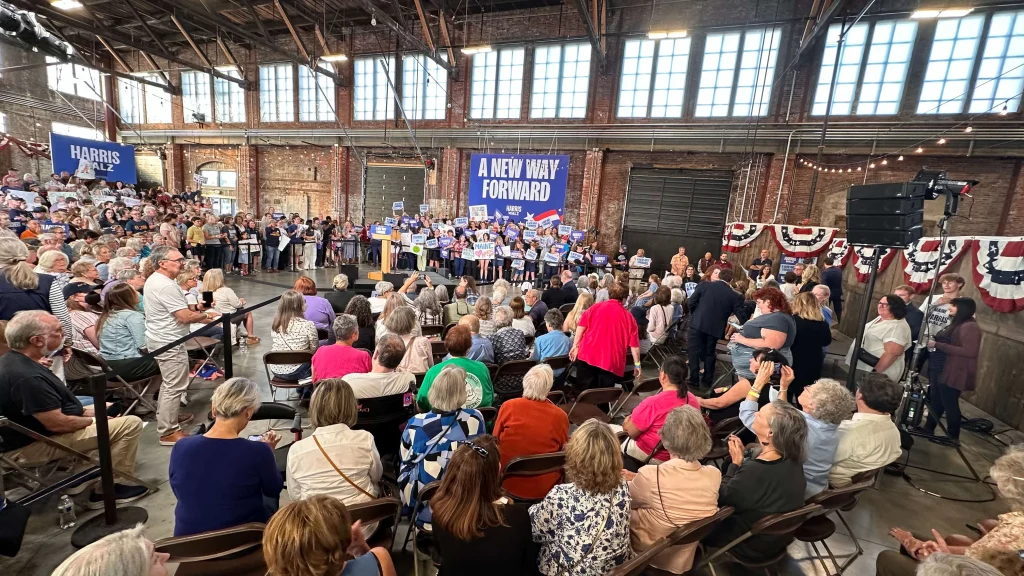Audience members in the crowd of a New Way Forward campaign rally